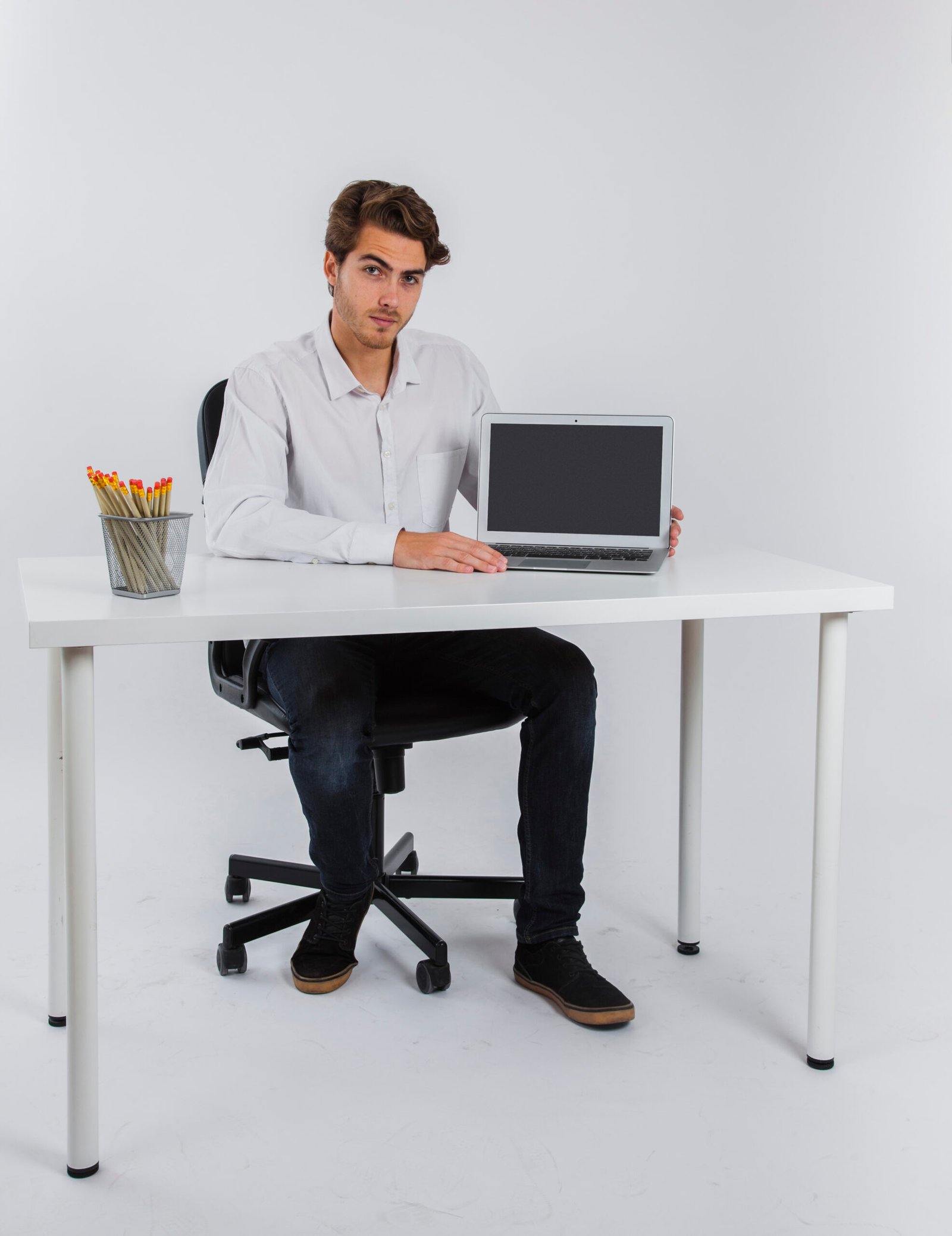 businessman posing with laptop
